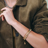 A model showcasing Hailey Gerrits beaded and layered bracelets from the Fall Winter 2025 collection.